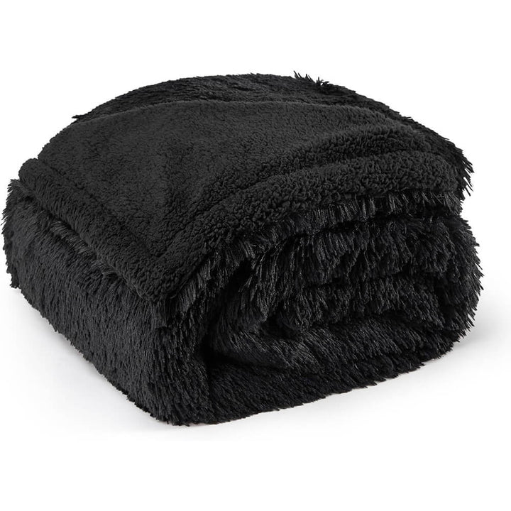 Waterproof dog blanket acting as animal bedding, keeping a dog crate warm and clean