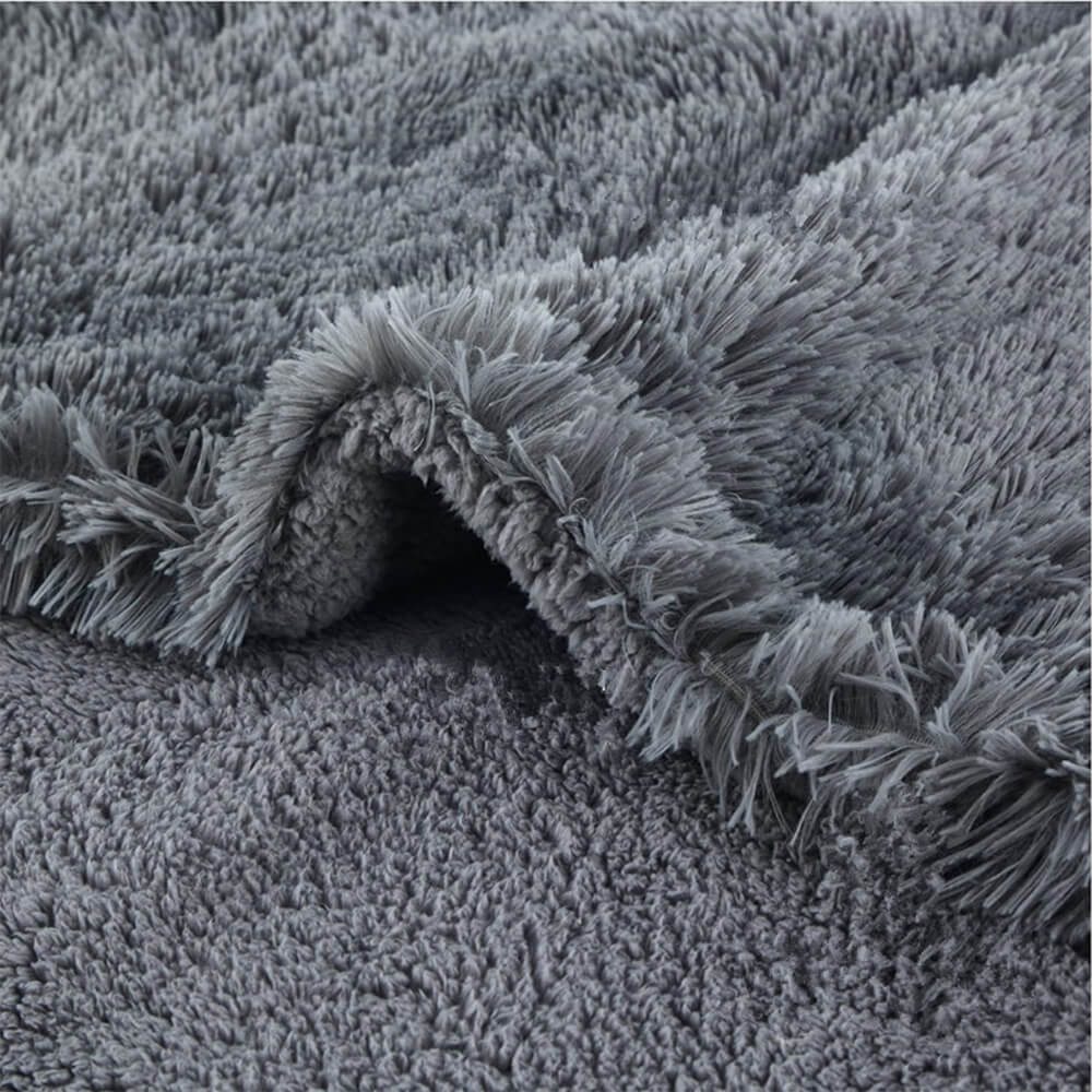 Close-up of the plush texture of a waterproof dog blanket, showing its softness