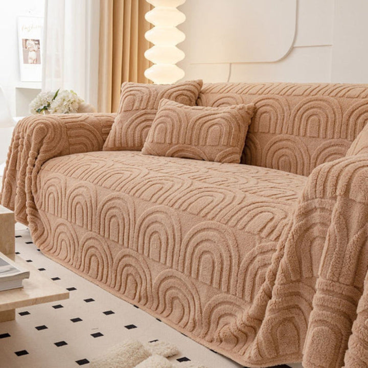 Plush wave pattern sofa cover in grey, offering cozy furniture protection with anti-slip backing for living room decor.