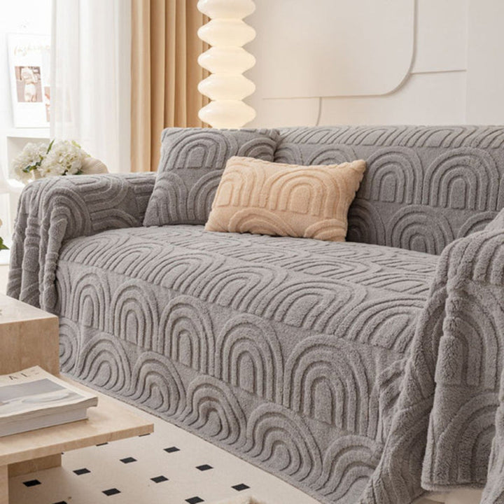 Close-up of soft plush sofa cover featuring an elegant wave pattern, designed with anti-slip backing for couches.