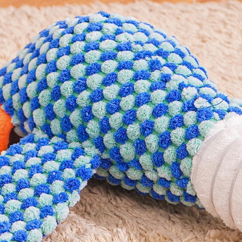 Close-up of a plush duck dog toy, a durable chew toy with internal squeaker