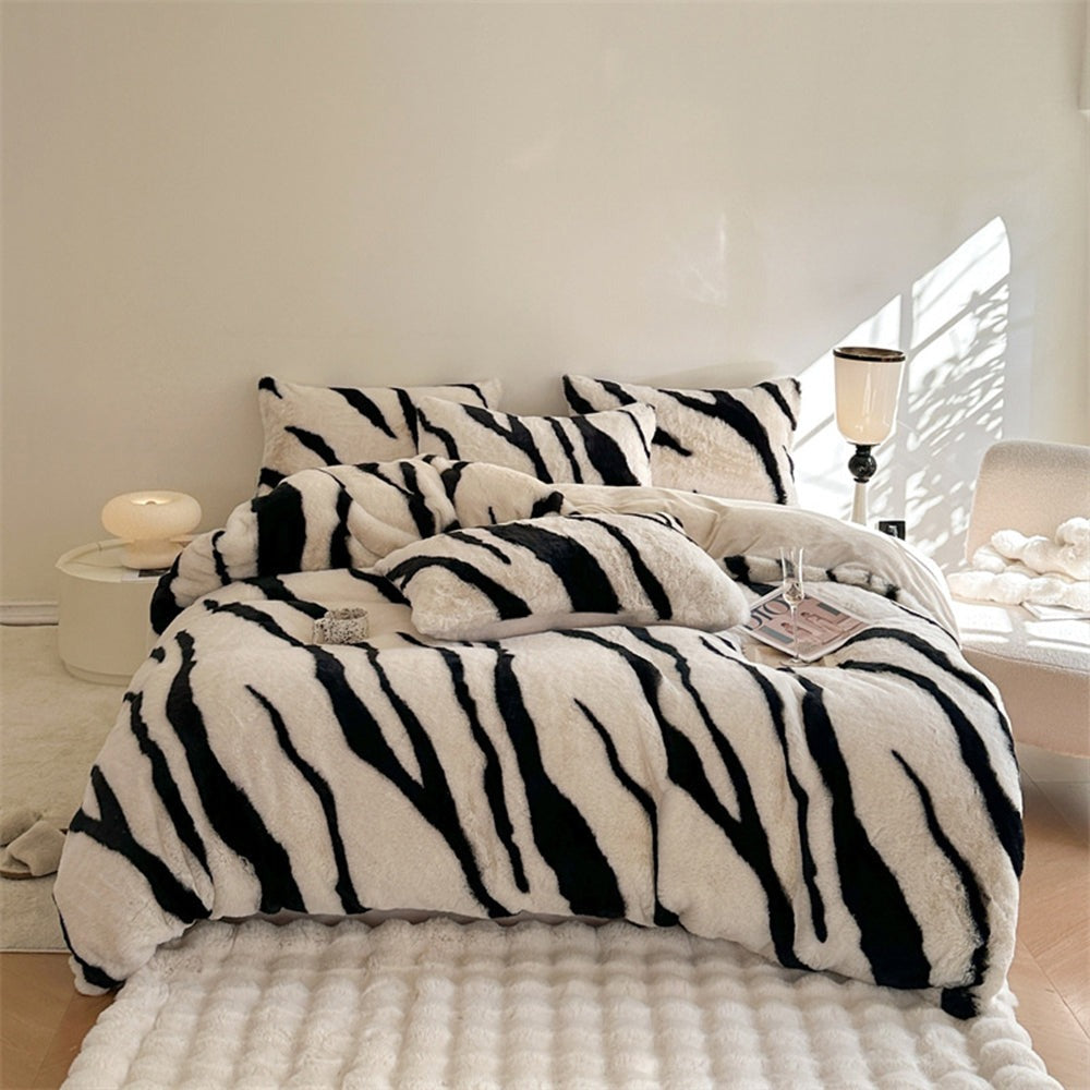 Unisex zebra fluffy faux fur bedding set, including duvet cover and pillowcases, on a king bed