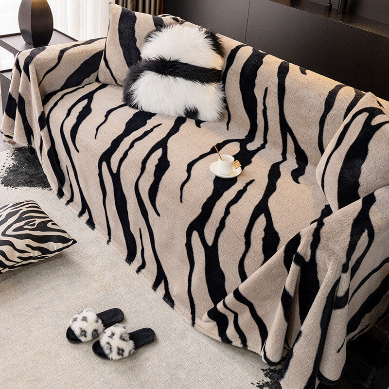Plush zebra print sofa cover on a living room couch, pet-friendly furniture protection