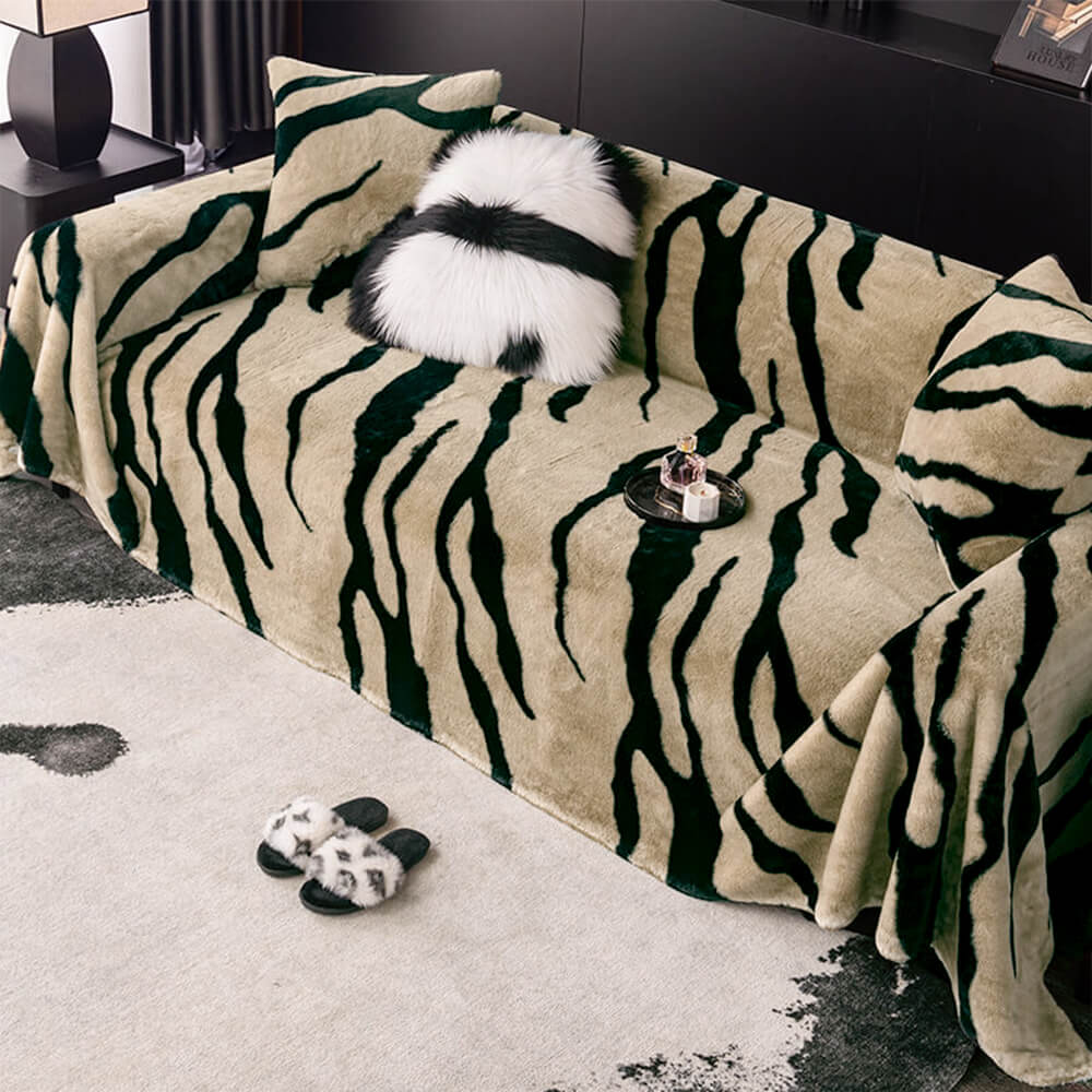 Close-up of soft zebra print plush couch cover, ideal for pet-friendly home decor
