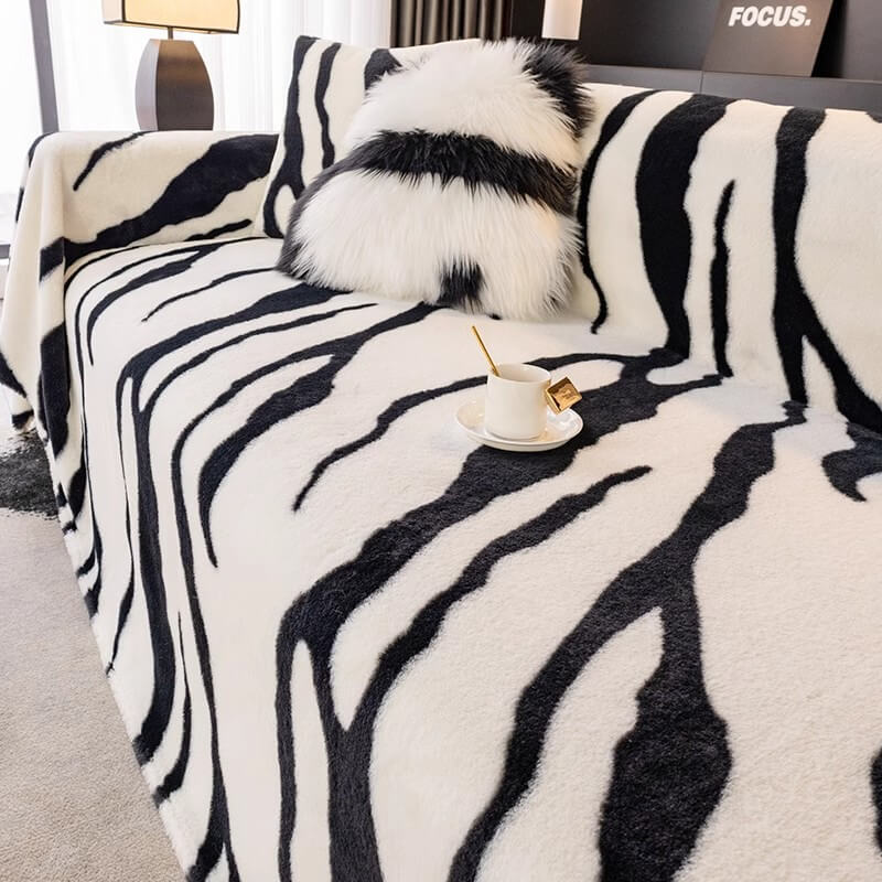 Zebra print sofa cover in a contemporary living space, stylish pet furniture protector