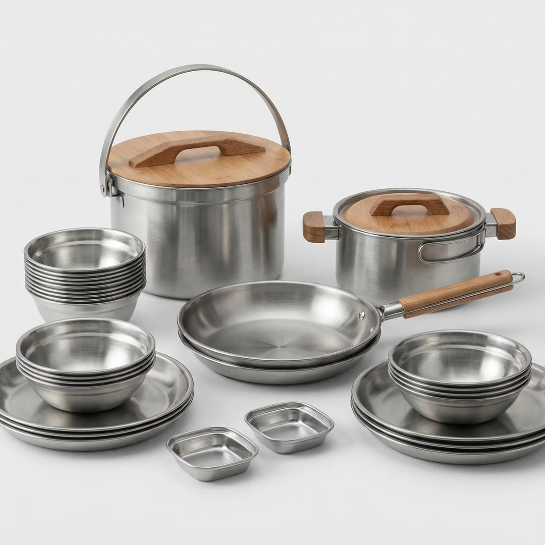 Compact camping cookware set being used for outdoor cooking, durable stainless steel for camp kitchen meals.