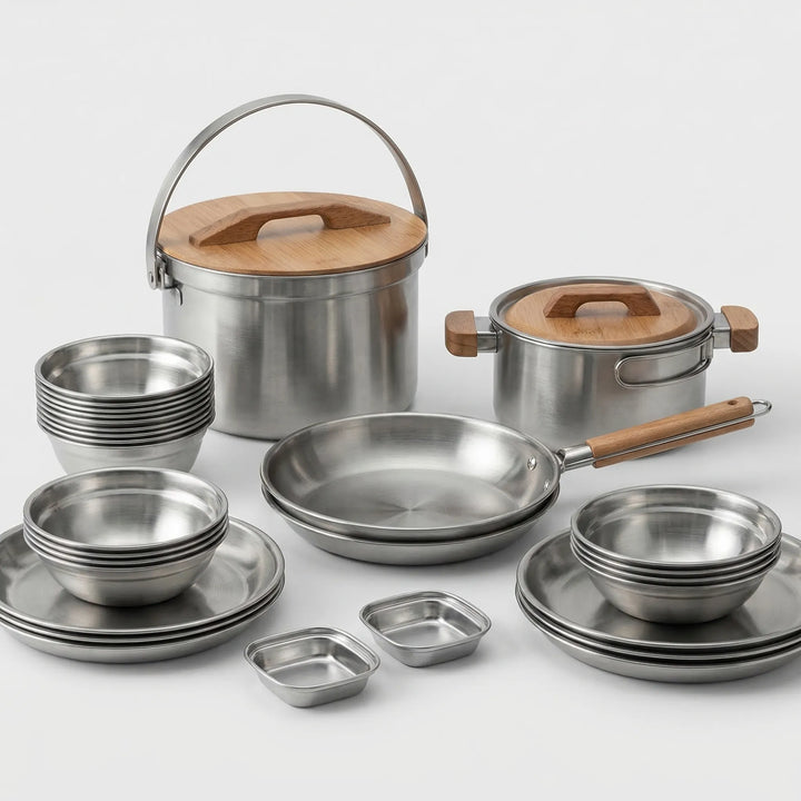 Compact camping cookware set being used for outdoor cooking, durable stainless steel for camp kitchen meals.