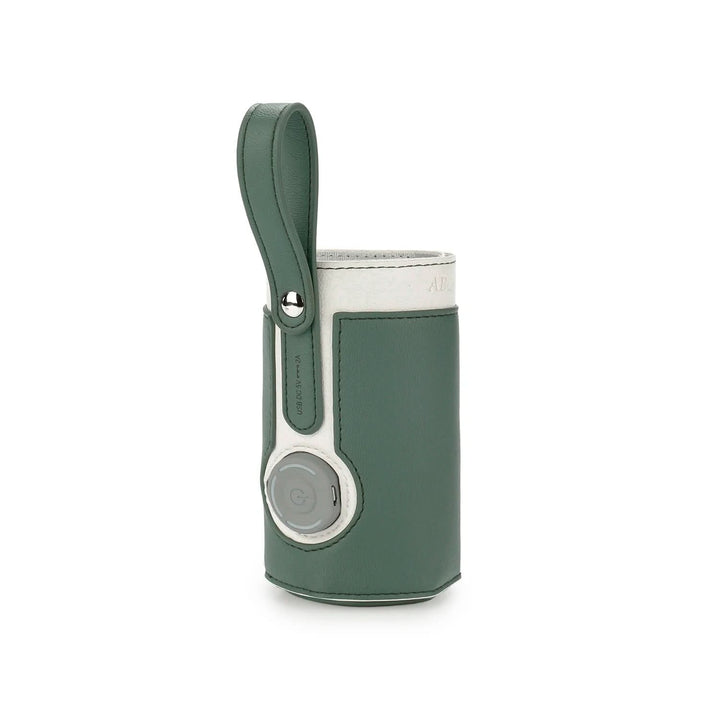 Sleek portable baby bottle warmer with secure strap, designed for convenient travel feeding.