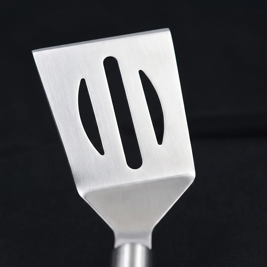 Complete barbecue tool set with spatula, tongs, and fork, organized in a portable case for tailgating fun.