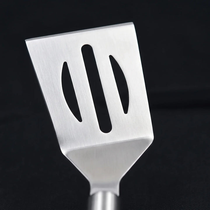 Complete barbecue tool set with spatula, tongs, and fork, organized in a portable case for tailgating fun.