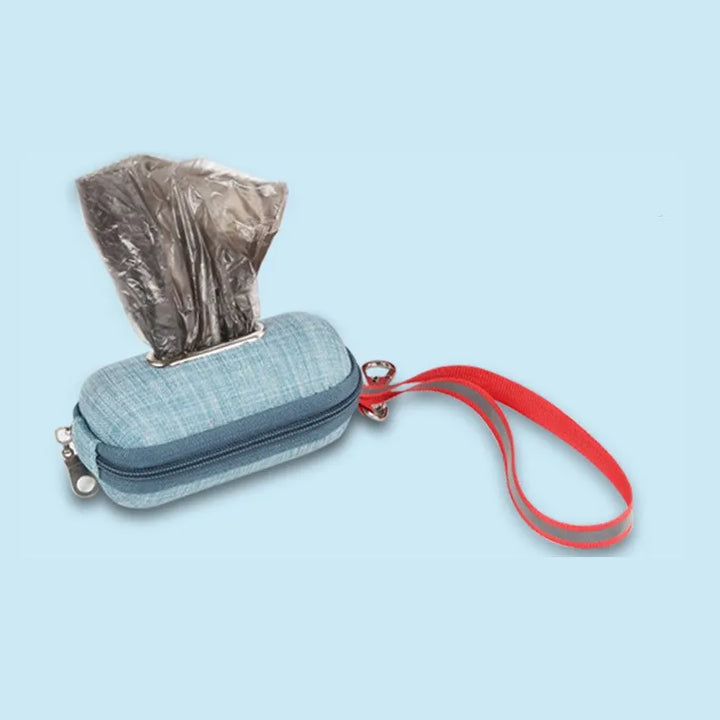 Waste bag dispenser for dogs, shown with a roll of bags, supporting responsible pet ownership on walks.