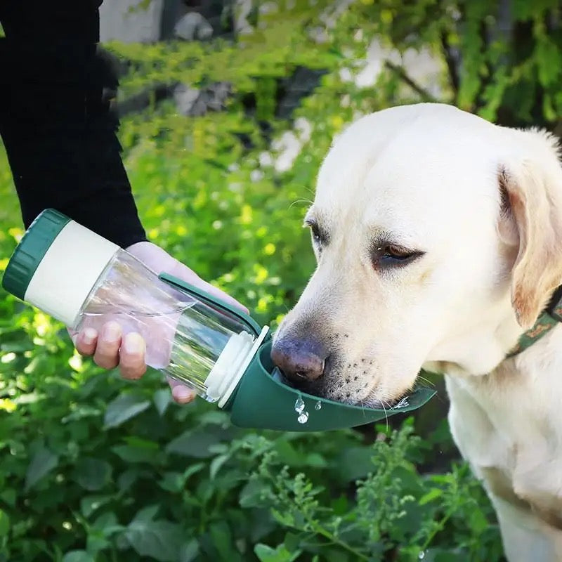 Portable dog water and snack bottle, blue, ideal for outdoor travel and hiking with pets.