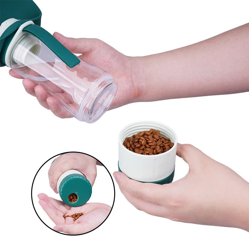 Portable blue dog water bottle with integrated snack compartment, perfect for pet hydration and treats.