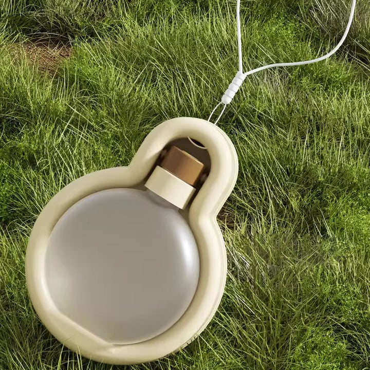 Outdoor dog gear: a portable water bottle that doubles as a feeder for convenient pet travel.