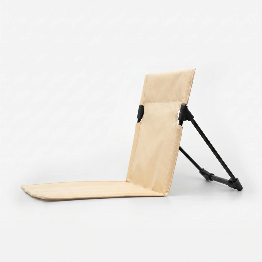 Lightweight portable folding floor chair, easy to carry for travel, camping, and outdoor events.