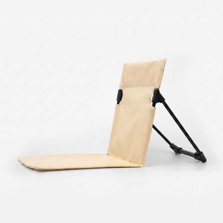 Lightweight portable folding floor chair, easy to carry for travel, camping, and outdoor events.