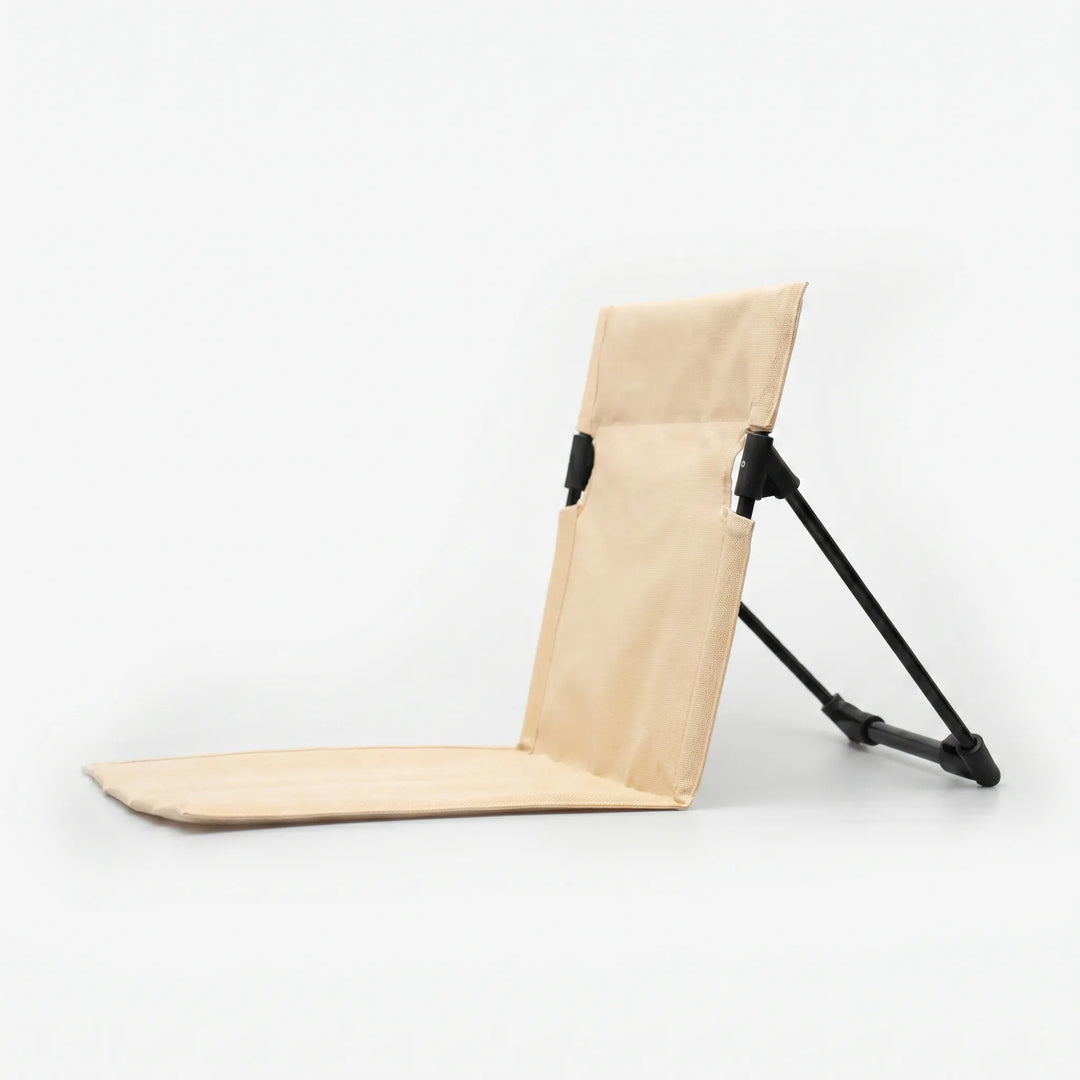 Travel-friendly portable folding floor chair, perfect for outdoor concerts, sporting events, and impromptu seating.