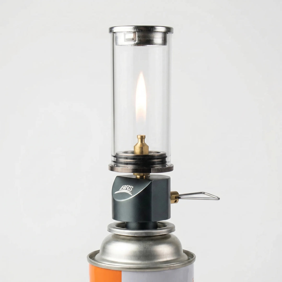 Portable gas camping lantern, windproof design for reliable outdoor lighting during hiking & travel.