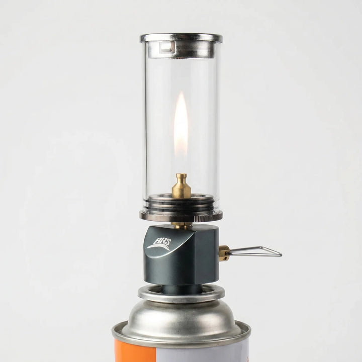 Portable gas camping lantern, windproof design for reliable outdoor lighting during hiking & travel.