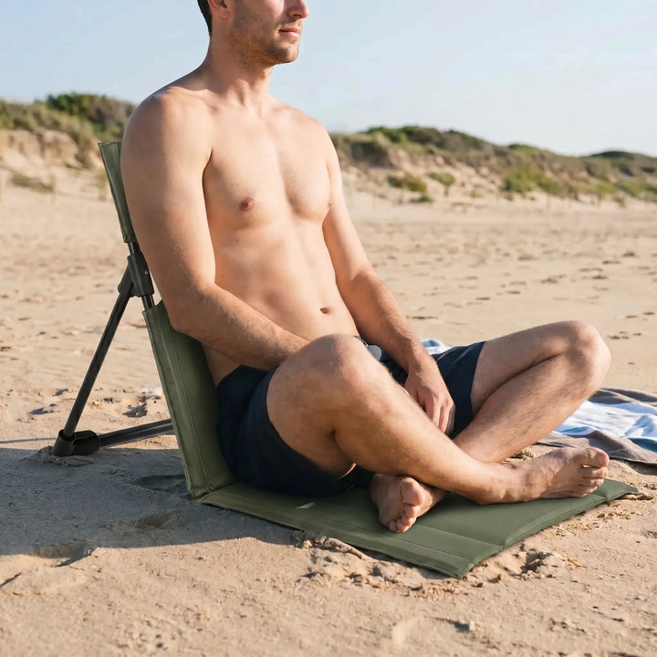 Lightweight beach chair, a portable ground seat for sandy shores & festivals. Easy to carry folding design.