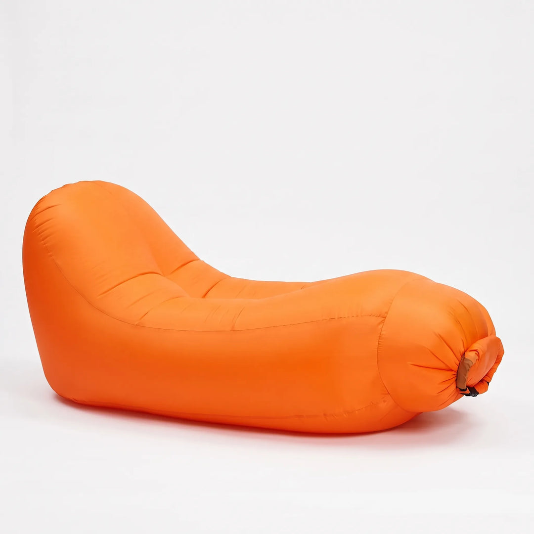 Durable inflatable sun lounger for outdoor living. Portable and comfy seating solution for beach, garden, or patio.