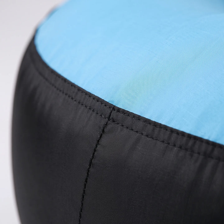 Easy setup inflatable outdoor lounger. Portable seating for camping, beach trips, or garden relaxation. Travel comfort.