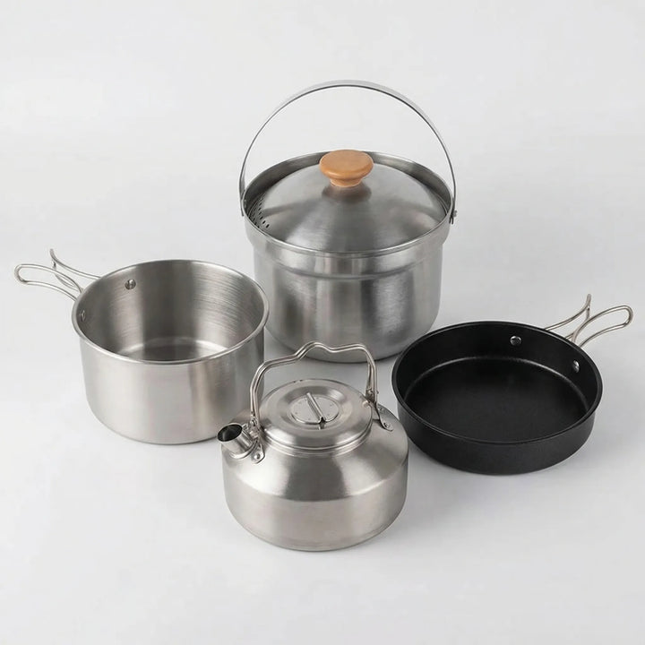 Nesting camp kitchen cookware set for outdoor cooking. Includes portable pot, frying pan, and kettle for adventurers.