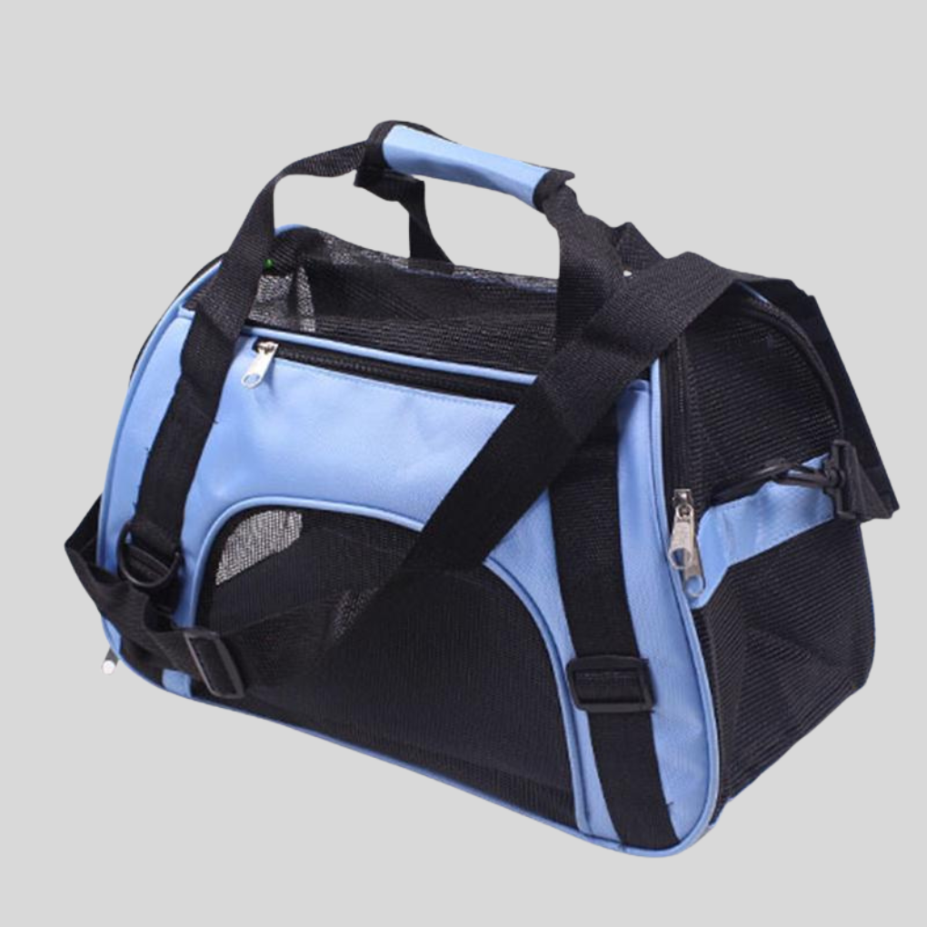 Mesh pet carrier for small dogs and cats, lightweight and portable, ideal for travel.