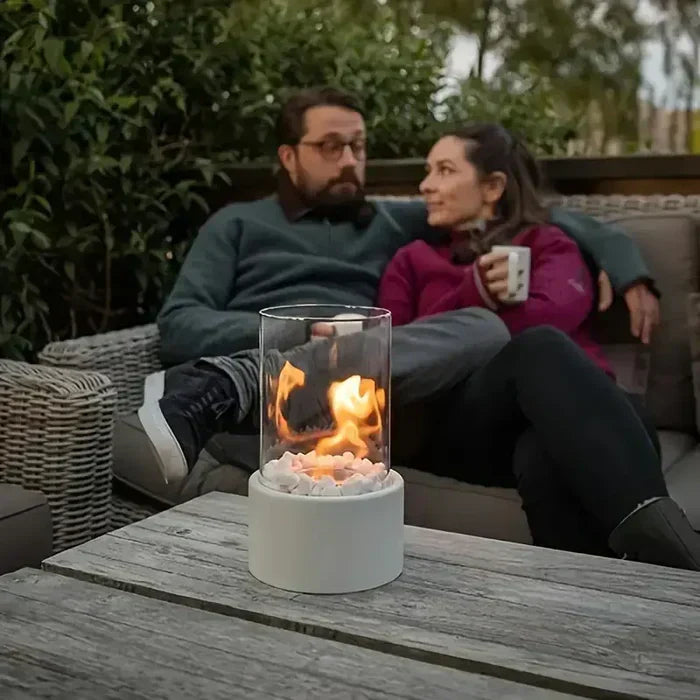 Decorative tabletop fire lantern for cozy outdoor living & modern home ambiance. Steel glass.