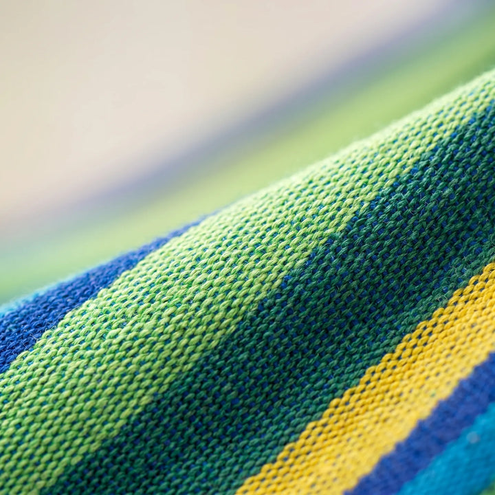 Durable portable outdoor hammock for camping, travel, and garden relaxation. Striped canvas, easy to pack.