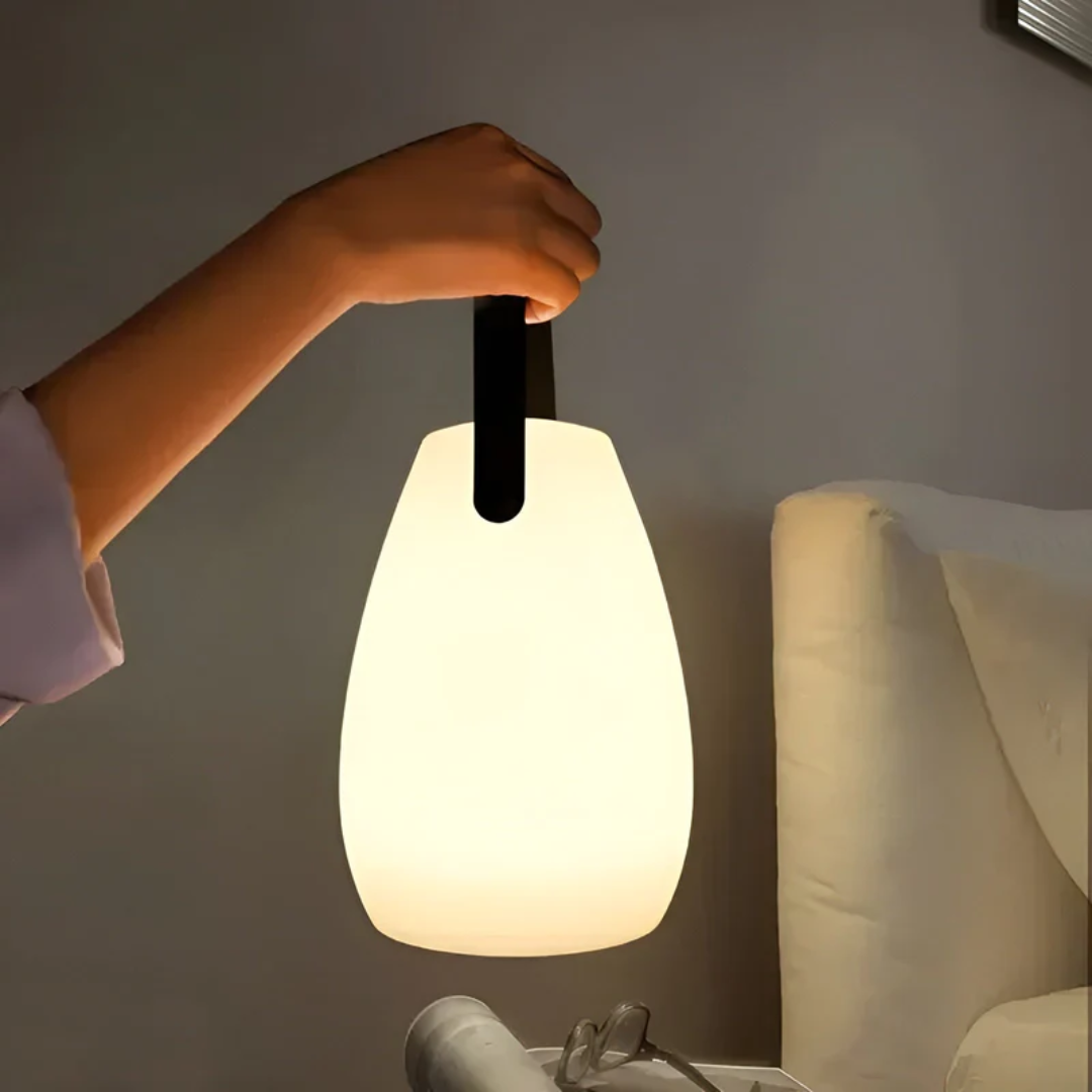 Portable wireless LED table lamp, RadianceFlex, perfect for indoor & outdoor use. Rechargeable & modern design.