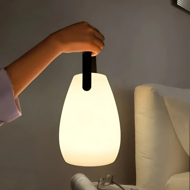 Portable wireless LED table lamp, RadianceFlex, perfect for indoor & outdoor use. Rechargeable & modern design.