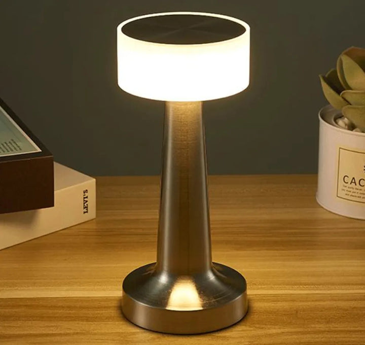 Rechargeable wireless LED table lamp, dimmable touch control for bedroom & living room accent lighting.