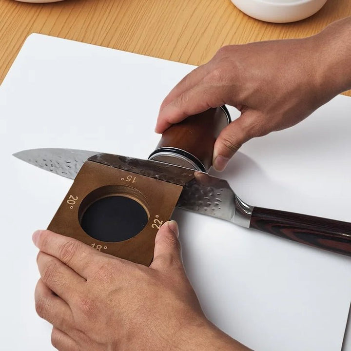 Professional kitchen knife sharpener, features diamond wheel and adjustable angle for perfect edge.
