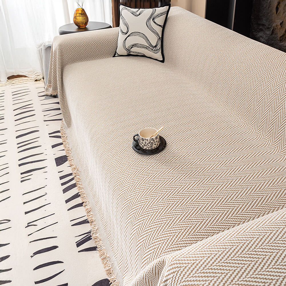 High-quality chenille herringbone sofa cover, complete with attractive fringe details.