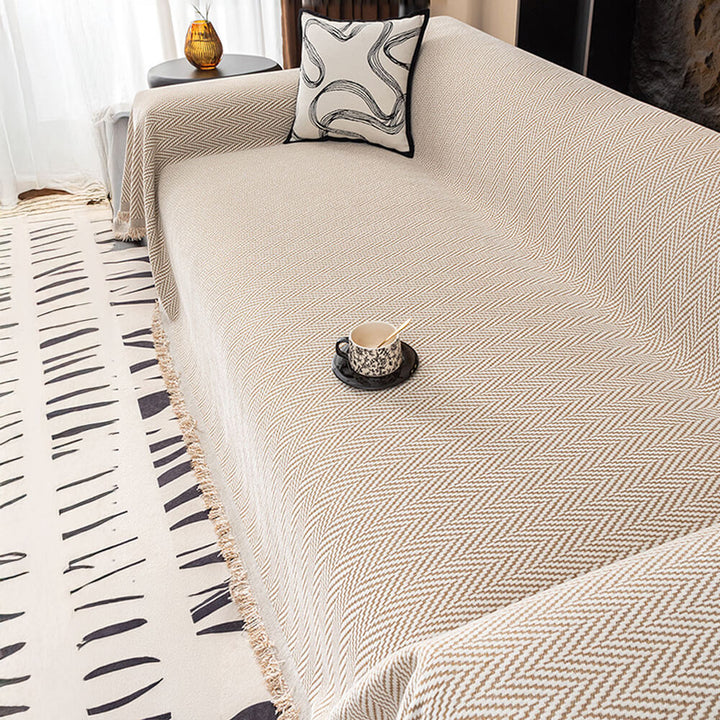 High-quality chenille herringbone sofa cover, complete with attractive fringe details.