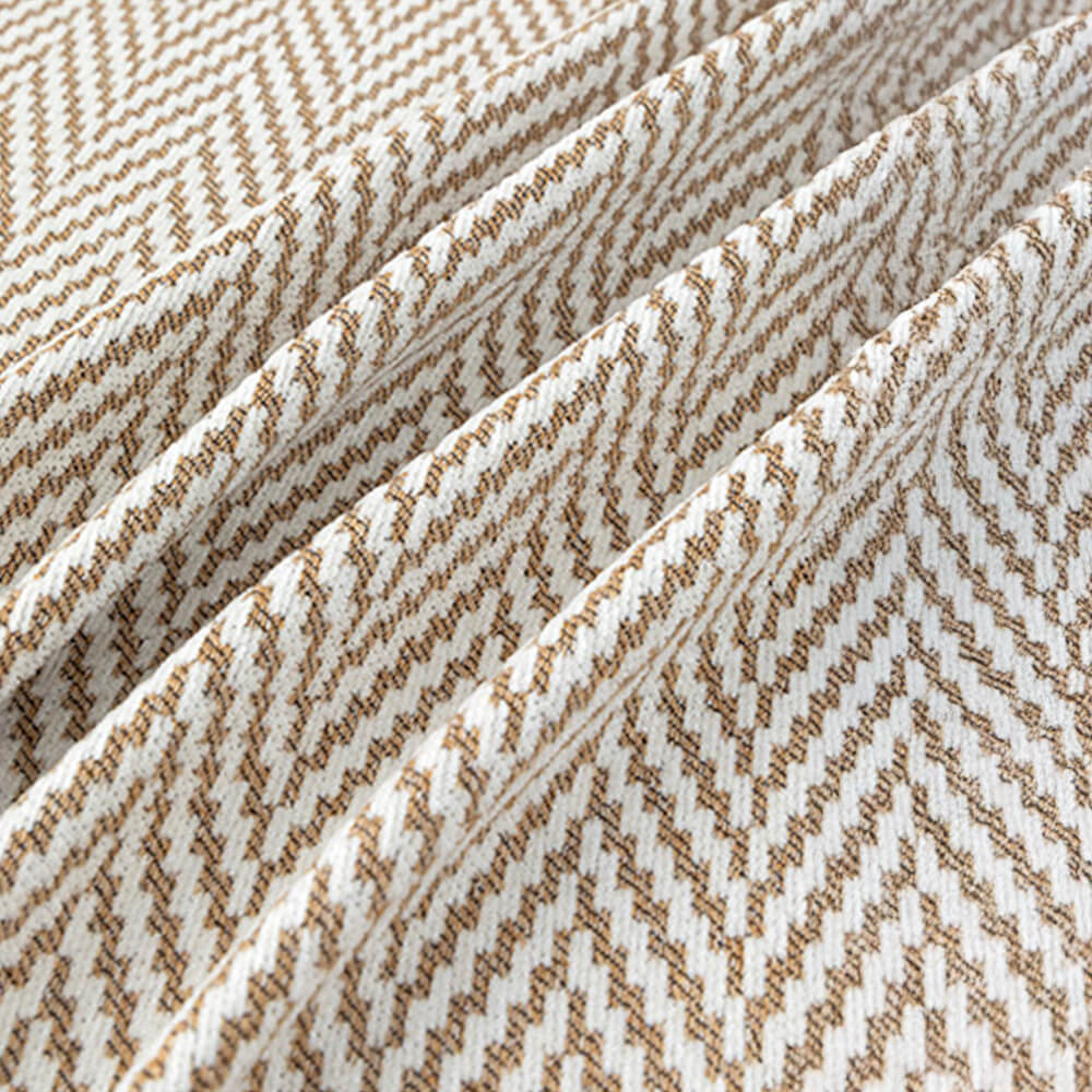 Durable chenille herringbone throw with fringe, ideal furniture protector for couches.