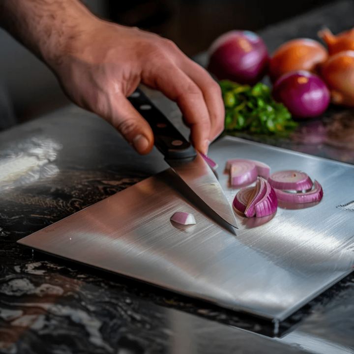 Sleek stainless steel cutting board, dishwasher safe & durable. Perfect for hygienic food preparation in any kitchen.