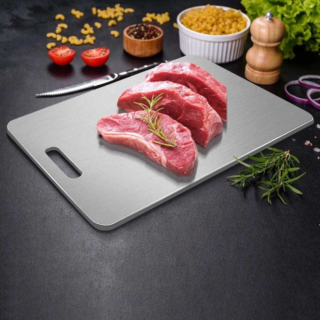 Close-up of a premium stainless steel cutting board, ideal for preparing meats & vegetables hygienically in the kitchen.