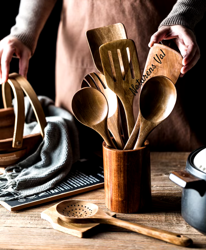 Assortment of eco-friendly teak wood kitchen tools, perfect for a sustainable, healthy cooking lifestyle.