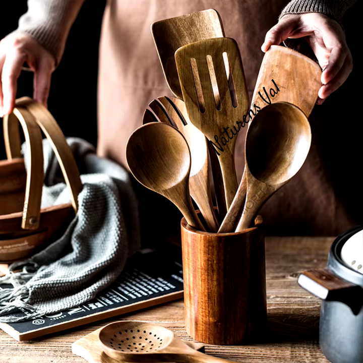 Stylish teak wood utensil holder, keeps kitchen tools organized. Natural aesthetic, complements any decor.