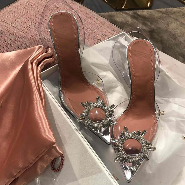 Stylish women's transparent high heels with sparkling crystal embellishments & sleek pointed toe.