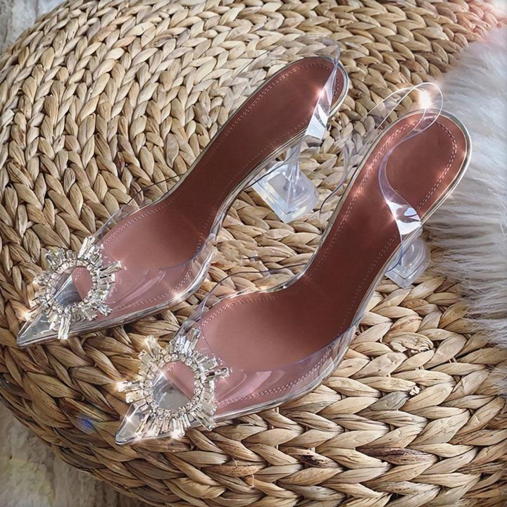 Fashionable clear crystal high heels for women, featuring a sharp pointed toe for a sophisticated party look.