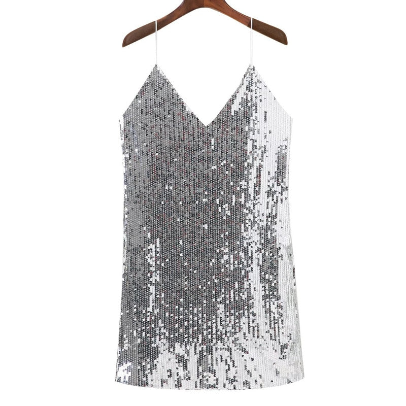 Women's dazzling silver sequined mini dress, perfect for parties & special occasions. Glamorous evening wear.