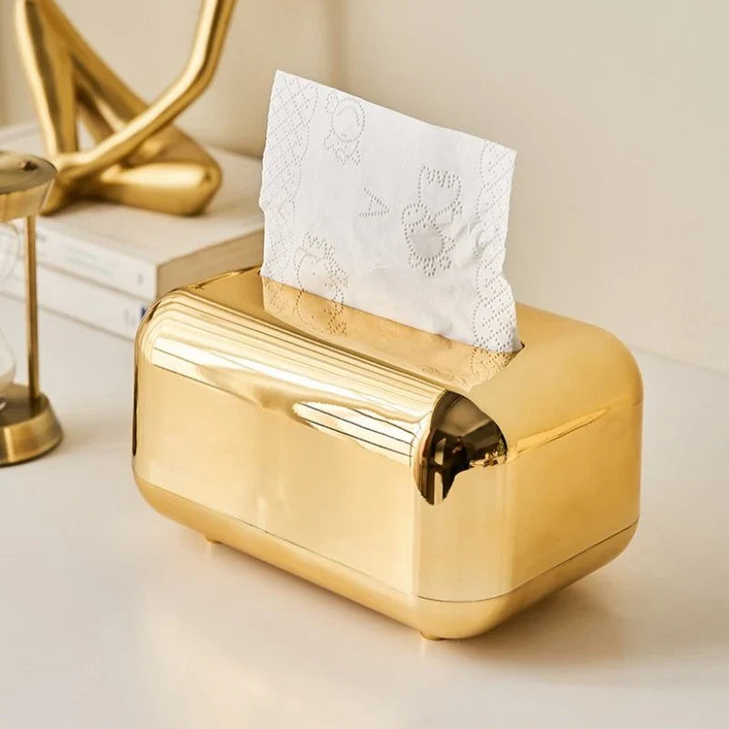 Elegant modern gold & silver tissue dispenser for luxury home decor.