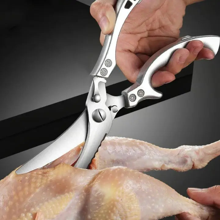 Professional heavy-duty stainless steel kitchen shears for effortless poultry and meat cutting.