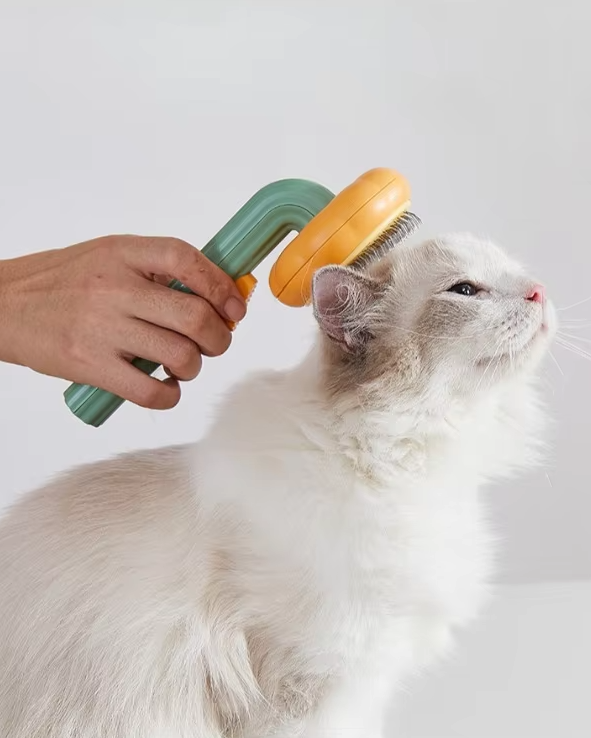 Ergonomic pet brush for cats, effectively removes loose fur during grooming
