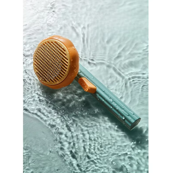 Cat care fur remover brush with a comfortable handle for easy grooming