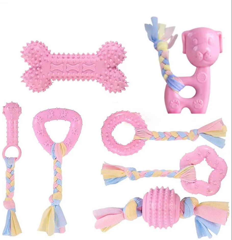 Assorted puppy chew toys to promote dental health, including durable rope and soft plush designs.