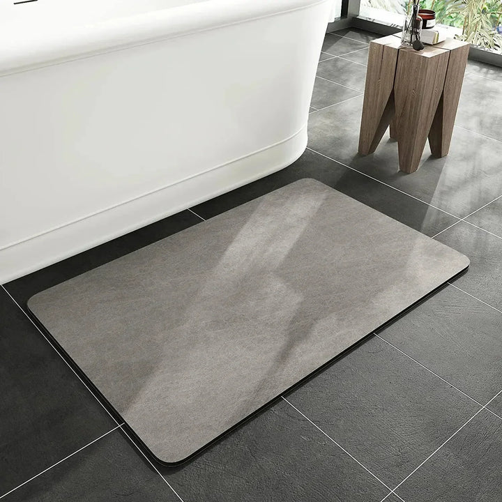 Stylish quick-dry diatomite bath mat underfoot, anti-slip & absorbent. Perfect modern bathroom decor.